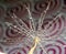 Part of the dandelion seed with water droplets on the background with circles