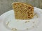 A part of delicious banana cake on white plate