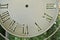 Part of the dial, vintage wall clocks, closeup dial with Roman numerals