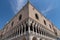 Part of the facade of Doge`s Palace Palazzo Ducale in Venice during the day show the detailed gothic style architecture