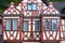 part of historic building, beautiful facade ancient half-timbered house of European German architecture, wood patterns, historic