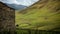 A part of the house and fields and mountains behind in Svaneti region, republic of Georgia