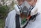 Part of human face in multi-purpose respirator half mask with chemical protective clothing