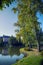 Part of lake with reflection of trees and bridge