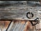 Part of a medieval barn door with wood grain and iron rings