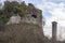 Part of the old Malnido castle ruins in Villafranca in Lunigiana, and Saint Nicolo church tower. Removal of vegetation
