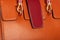 Part of a orange leather ladies bag with good texture