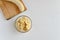 A part of the peeled banana on the cutting board and fresh ripe organic sliced bananas in a glass bowl.