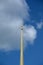 Part of a spire of the Peter and Paul Fortress against the background of the sky and clouds