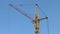 Part of turning stationary hoist on construction site, blue sky