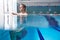 Part Underwater View Of Male Swimmer Warming Up In Swimming Pool