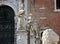 Part of Venetian Arsenal`s facade with sculptures and door.