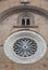 Part of a wall with the rose window of the Cathedral of Crema in the province of Cremona in Lombardy (Italy)