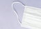 Part of a white surgical mask, 3-layer mask to cover the mouth and nose. The procedure of the mask against bacteria. The