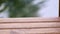 Part of wooden empty bridge on a flowing river background. Tranquility at beautiful calm summer day.