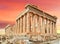 Parthenon monument athens greece pink sunset colors on the sky
