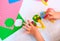 partial blurred Child modeling fun craft . Modeling clay and paper crafts idea for kids. Activity in kindergarten and at home