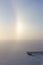 Partial halo and pier at a frozen & snowy lake