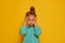 Partial image of serious little girl looking at camera. Portrait of beautiful caucasian female child wearing color dress