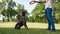 Partial man training Kurzhaar dog catching ring