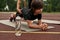 Partial mother helping caucasian son doing plank