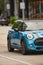 Partial photo of blue Mini Cooper automobile