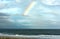 A partial rainbow over the ocean.