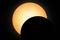 Partial solar eclipse. The silhouette of the moon