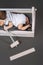 partial view of adorable baby with hammer in hand sleeping in wooden toolbox with daddys