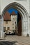 Partial view of Annecy castle through the entrance gate and stone arch in Annecy.