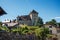 Partial view of Annecy castle and houses with a wall in Annecy.