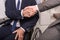 partial view of businessmen in suits shaking hands