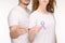 partial view of couple holding awareness ribbons of different colors