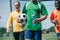 partial view of multicultural elderly men with sportive water bottles