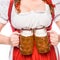 partial view of oktoberfest waitress in traditional german dress holding mugs of light beer