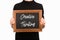 Partial view of woman holding chalkboard with lettering creative thinking