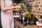 partial view of woman preparing pepper for dinner in kitchen