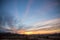 Partially Cloudy Dramatic Sunset Sky over Winter Fields and Mead