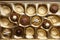 Partially empty box of chocolate candies as background, top view