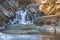 Partially frozen Scott`s Run waterfall at sunrise.Scott`s Run Nature Preserve.Fairfax County.Virginia.USA
