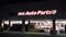 Partially lighted Advance Auto Parts front store sign with logo at night. NJ, USA.