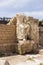 Partially preserved statue of white marble in the ruined city of