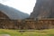 Partially restored buildings and stone wall of the Incan ruins at Ollantaytambo