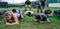 Participants in an obstacle course crawling