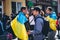 Participants in the peaceful protest are wrapped in the Ukrainian flag.