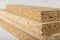 Particleboard with veneer is cut into small pieces. Materials for carpenters to build furniture