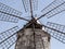 A particular close shot of an old windmill located in the salt pans of