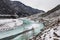 Partly frozen turquoise river Chuya in winter, Altai Republic