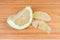 Partly peeled ripe pomelo on a wooden cutting board