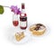 Partly sliced sponge cake and red sparkling wine against orchid